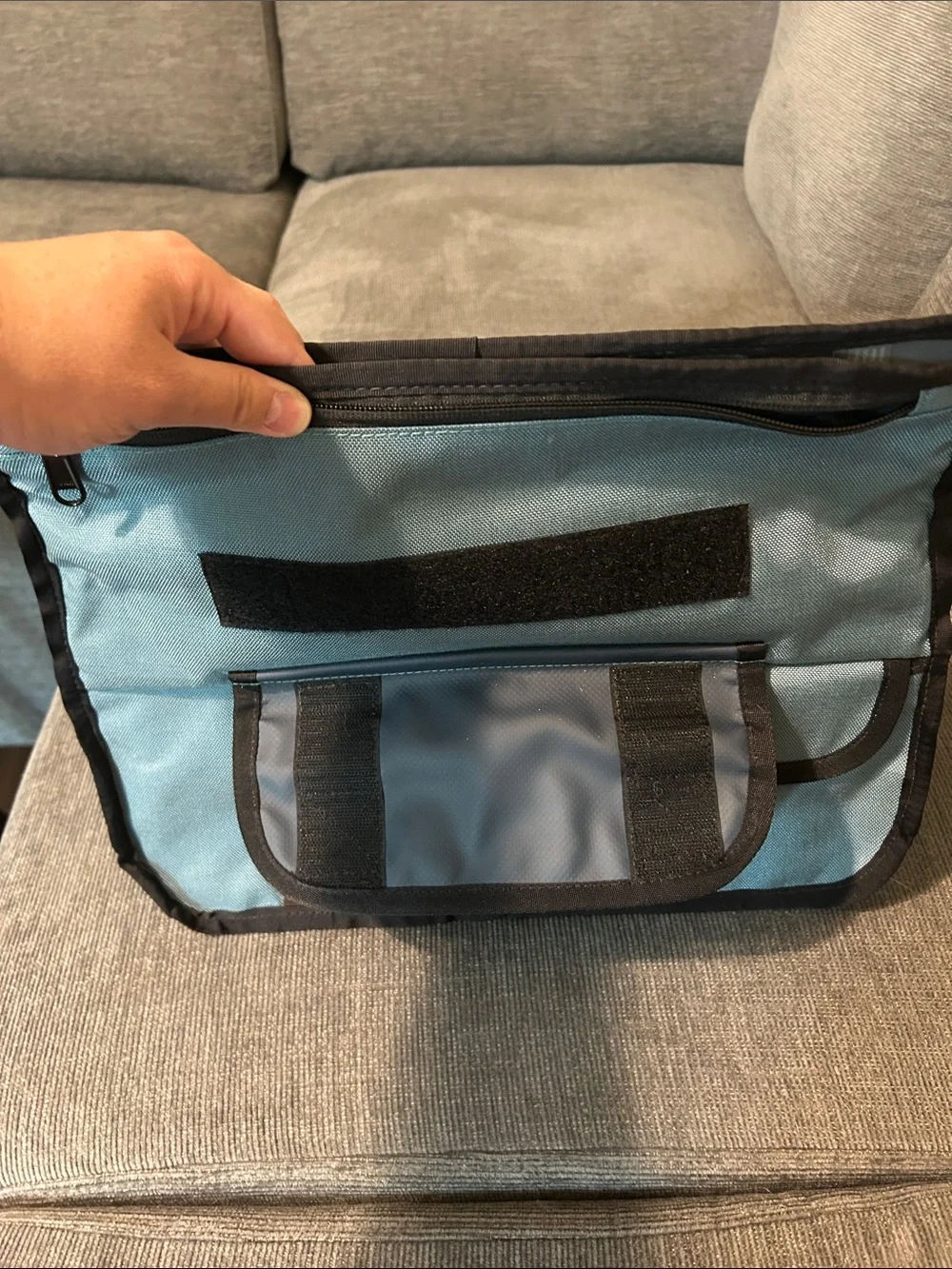 Light Blue Messenger Bag with Black Trim and Adjustable Strap
